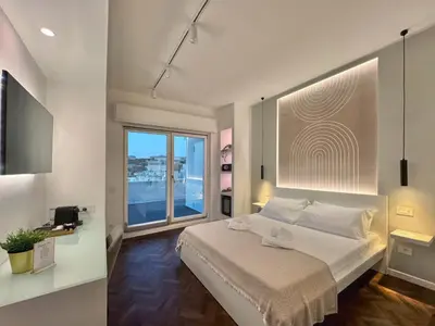 Letto o letti in una camera di Mameli View Cagliari