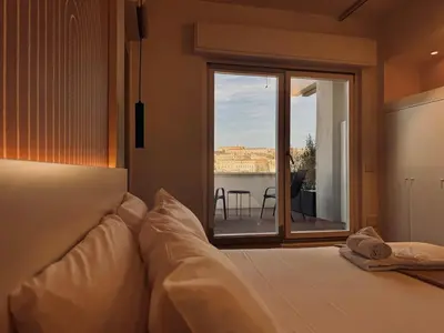 Letto o letti in una camera di Mameli View Cagliari