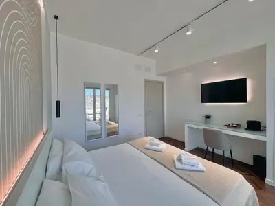 Letto o letti in una camera di Mameli View Cagliari