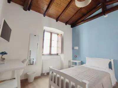 Letto o letti in una camera di Donna Raffaela