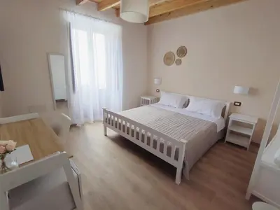 Letto o letti in una camera di Donna Raffaela