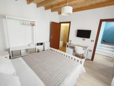 Letto o letti in una camera di Donna Raffaela