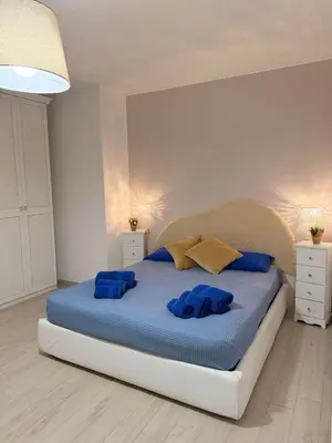 Letto o letti in una camera di Casa Vacanze Nerea - Relax e Mare vicino a Cagliari in Sardegna