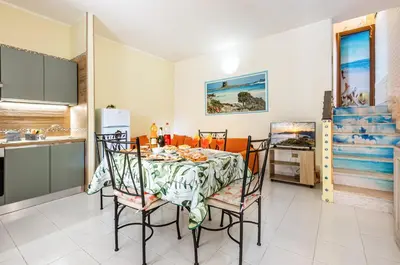 Cucina o angolo cottura di GuestHost - La Collina Villasimius - Yellow Apartment!