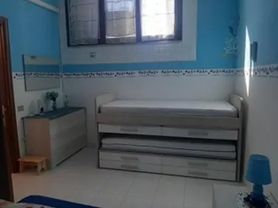 Letto o letti in una camera di GuestHost - La Collina Villasimius - Yellow Apartment!