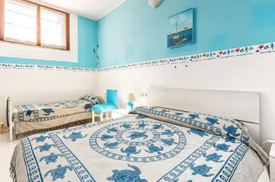 Letto o letti in una camera di GuestHost - La Collina Villasimius - Yellow Apartment!