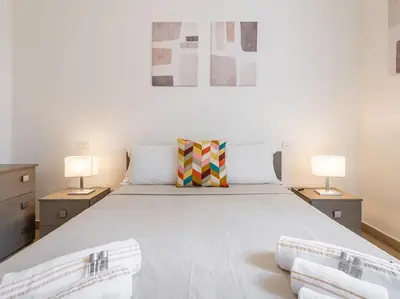 Letto o letti in una camera di Il Giardino Apartment- Between Beach and City Center Cagliari
