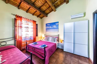 Letto o letti in una camera di Affitacamere/Domo - Mari e Luci