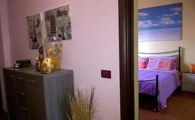 Letto o letti in una camera di Affitacamere/Domo - Mari e Luci