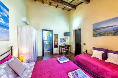 Letto o letti in una camera di Affitacamere/Domo - Mari e Luci