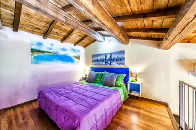 Letto o letti in una camera di Affitacamere/Domo - Mari e Luci
