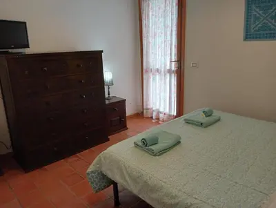 Letto o letti in una camera di Casa Helichrysum