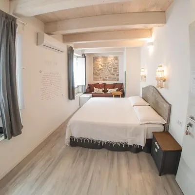 Letto o letti in una camera di B&B Terra - Stanza Poesia