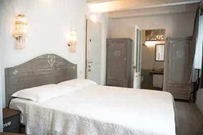 Letto o letti in una camera di B&B Terra - Stanza Poesia