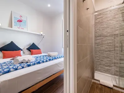 Letto o letti in una camera di Cagliari Lifestyle Apartment