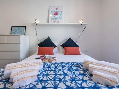 Letto o letti in una camera di Cagliari Lifestyle Apartment