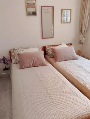 Letto o letti in una camera di Casa Erminia