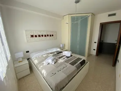 Letto o letti in una camera di Casa Tharros I.U.N. R7621