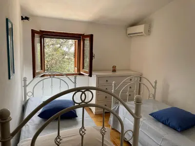 Letto o letti in una camera di Villino Il Lentischio