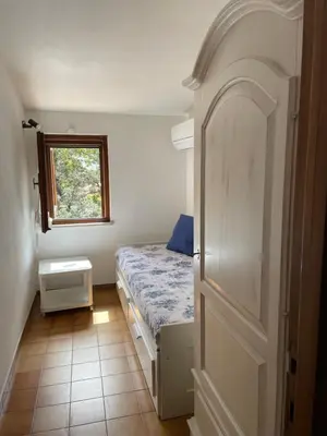Letto o letti in una camera di Villino Il Lentischio