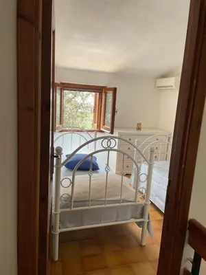 Letto o letti in una camera di Villino Il Lentischio