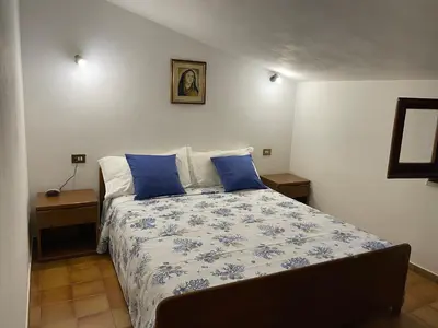 Letto o letti in una camera di Villino Il Lentischio