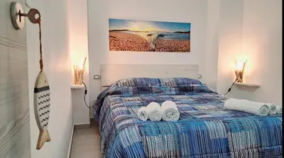 Letto o letti in una camera di FollowTheSun- Camera Fronte mare