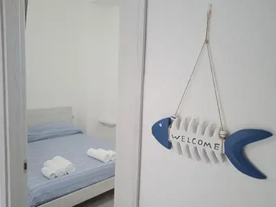 Letto o letti in una camera di FollowTheSun- Camera Fronte mare