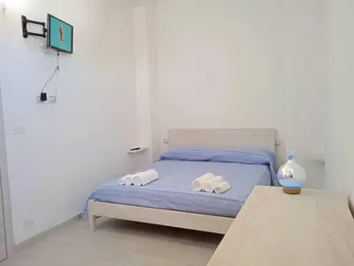 Letto o letti in una camera di FollowTheSun- Camera Fronte mare