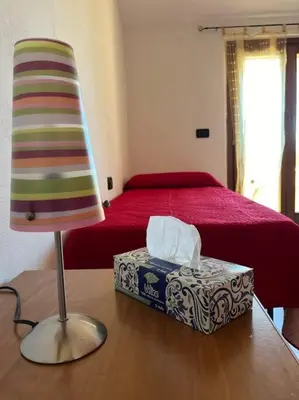 Letto o letti in una camera di Casa Sole Piscinas