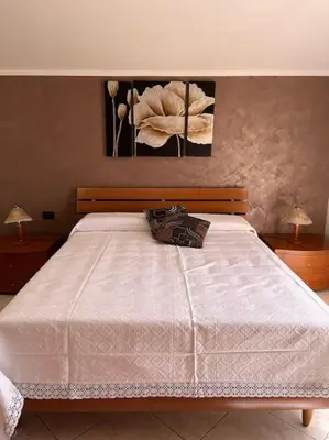 Letto o letti in una camera di Casa Sole Piscinas