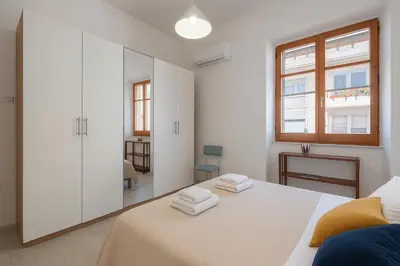 Letto o letti in una camera di Casa Ofride -Centro-Poetto 10 min-Wi-Fi-Netflix