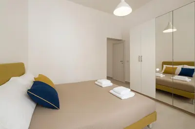 Letto o letti in una camera di Casa Ofride -Centro-Poetto 10 min-Wi-Fi-Netflix