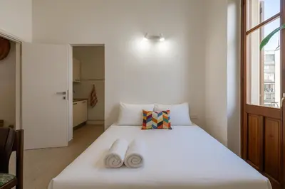 Letto o letti in una camera di Casa Ofride -Centro-Poetto 10 min-Wi-Fi-Netflix