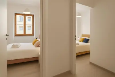 Letto o letti in una camera di Casa Ofride -Centro-Poetto 10 min-Wi-Fi-Netflix