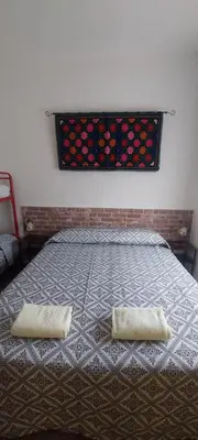 Letto o letti in una camera di Casa Scirocco Sardegna