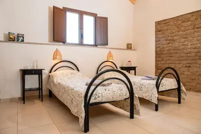 Letto o letti in una camera di Casa Sardinia