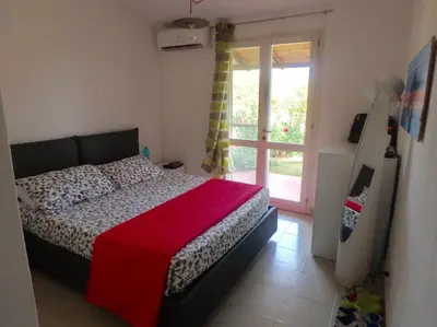 Letto o letti in una camera di Villetta vista mare sulla spiaggia di Porto Giunco