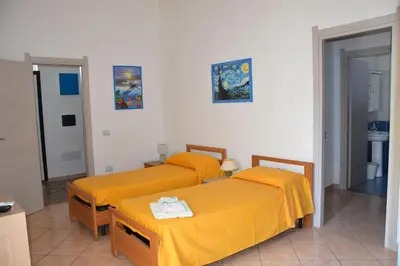 Letto o letti in una camera di Casa Iolanda