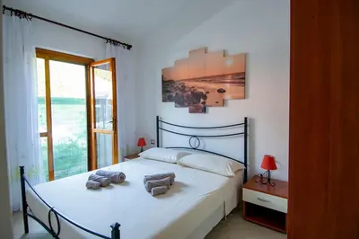 Letto o letti in una camera di Casa Kody a 500 mt dalla spiaggia di Geremeas