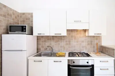 Cucina o angolo cottura di Casa Kody a 500 mt dalla spiaggia di Geremeas