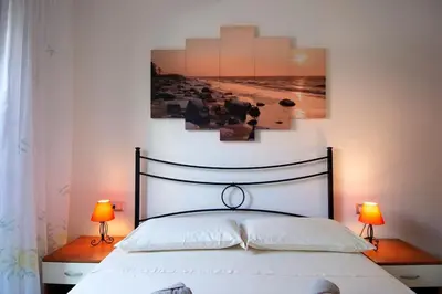 Letto o letti in una camera di Casa Kody a 500 mt dalla spiaggia di Geremeas