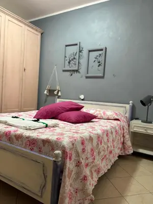 Letto o letti in una camera di La Fede Sarda