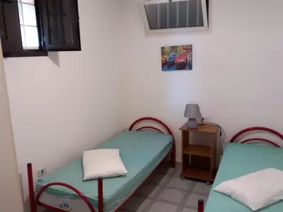Letto o letti in una camera di LA ROCCIA SUL MARE