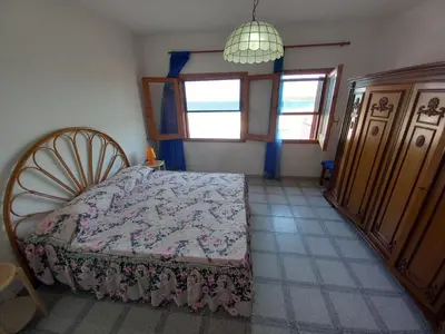 Letto o letti in una camera di LA ROCCIA SUL MARE