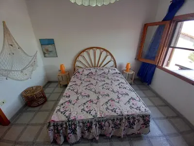 Letto o letti in una camera di LA ROCCIA SUL MARE