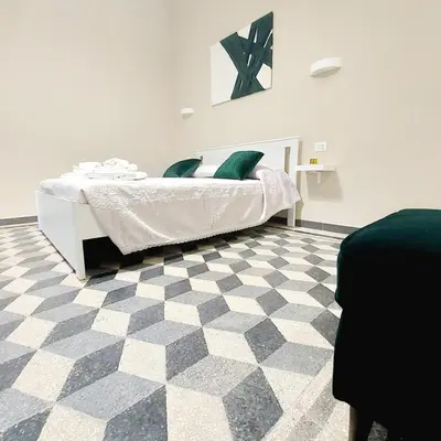 Letto o letti in una camera di Mariolina's Suites