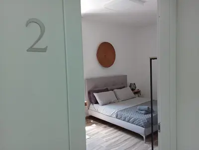 Letto o letti in una camera di NIU Rooms