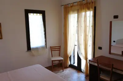 Letto o letti in una camera di Bari Sardo Le More Suite 3