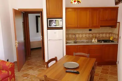 Cucina o angolo cottura di Bari Sardo Le More Suite 3